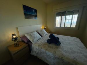 Llit o llits en una habitació de La casa de la playa