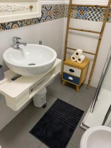 a bathroom with a sink and a toilet at Flat Graça 48 in Lisbon