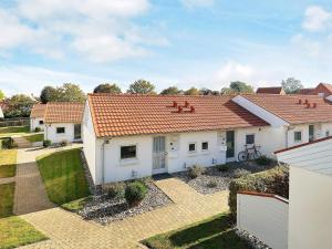 an aerial view of a house with an orange roof at 4 person holiday home in r sk bing in Ærøskøbing