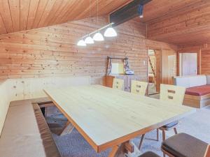 a wooden room with a wooden table and chairs at Glonersbühelhof Top 1 in Westendorf