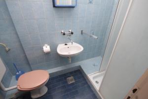 a bathroom with a toilet and a sink and a shower at Triple Room Pasman 8223a in Pašman