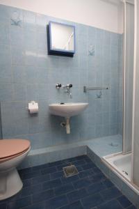 a bathroom with a sink and a toilet at Triple Room Pasman 8223a in Pašman