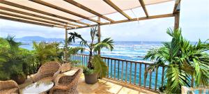 a balcony with a view of the ocean at CLEMARA EVASION in Schœlcher