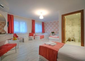 a hotel room with a bed and a living room at Hotel Abro Sezenler in Ankara