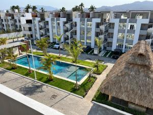 an aerial view of a apartment complex with a swimming pool at 5E Roof- Penthouse Manzanillo exclusivo con alberca in Manzanillo