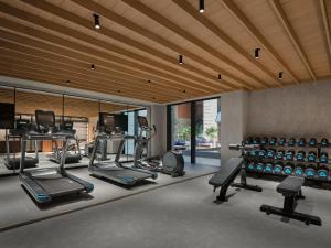 a gym with several treadmills and cardio machines at Hotel Indigo Hangzhou Uptown,Close to Westlake , boutique design hotel with freeflow minibar in Hangzhou