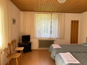 Postel nebo postele na pokoji v ubytování Gasthof Lublass