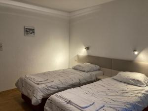 Postel nebo postele na pokoji v ubytování Gasthof Lublass