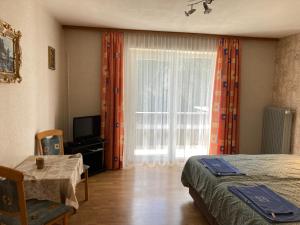 Postel nebo postele na pokoji v ubytování Gasthof Lublass