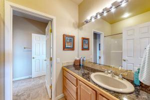 a bathroom with a sink and a mirror at High Country Haven in Pagosa Springs +24 photos