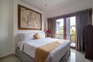 Ein Bett oder Betten in einem Zimmer der Unterkunft Villa Verano at Echo Beach Canggu