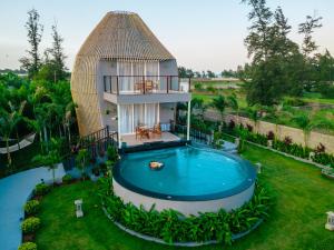 an aerial view of a house with a swimming pool at LOTUS VILLA in Chennai