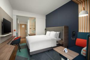 Säng eller sängar i ett rum på Holiday Inn Express Guiyang Qingyan, an IHG Hotel