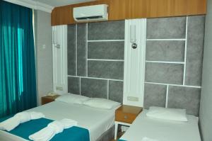 Postel nebo postele na pokoji v ubytování Side Yeşilöz Hotel