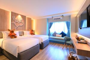 Letto o letti in una camera di Moose Hotel Nimman