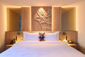 Letto o letti in una camera di Moose Hotel Nimman