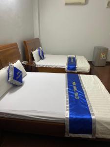 Postel nebo postele na pokoji v ubytování Khách Sạn Thanh Hồng