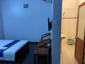 Postel nebo postele na pokoji v ubytování Khách Sạn Thanh Hồng