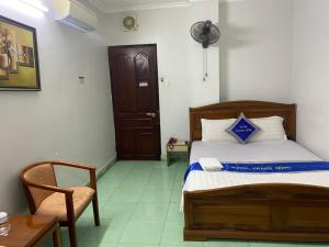 Postel nebo postele na pokoji v ubytování Khách Sạn Thanh Hồng
