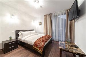 TV a/nebo společenská místnost v ubytování Chalet Belmont
