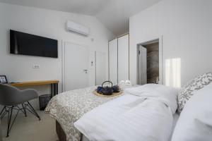 Postel nebo postele na pokoji v ubytování Vila Lavanda Muntrilj
