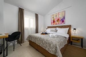 Postel nebo postele na pokoji v ubytování Vila Lavanda Muntrilj + 37 fotografií