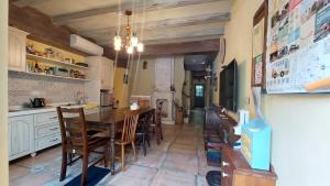 a kitchen with a table and chairs in a room at 小古堡民宿 The Little Castle - 完成訂房後務必要與屋主聯絡確認 in Tainan