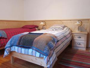 Un pat sau paturi într-o cameră la Di Baut