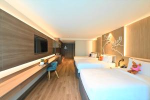 Letto o letti in una camera di Moose Hotel Nimman