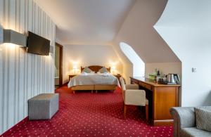 Postel nebo postele na pokoji v ubytování Hotel am Mirabellplatz