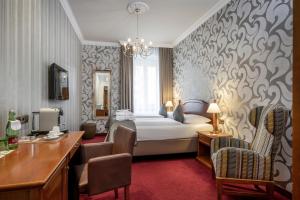 Postel nebo postele na pokoji v ubytování Hotel am Mirabellplatz