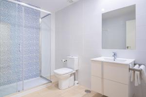 a bathroom with a shower and a toilet and a sink at Apartamentos La Rosita Old Town B-21 in Benidorm