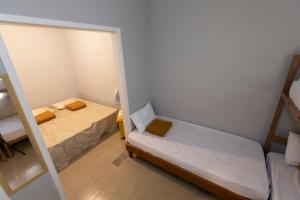 Cama ou camas em um quarto em Hostel Diniz
