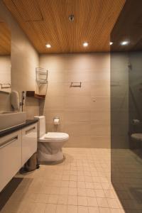 a bathroom with a toilet and a sink at Skihouse Apartment in Levi