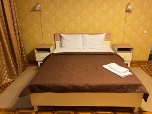 Postel nebo postele na pokoji v ubytování Dvoryanskiy Hotel