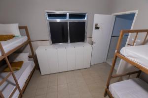 Cama ou camas em um quarto em Hostel Diniz
