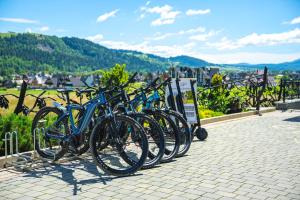 a row of bikes parked next to each other at Górski in Białka Tatrzańska