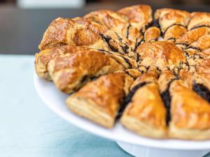 a plate of pastries on top of a table at ibis Styles Golden Sands Roomer Hotel in Golden Sands