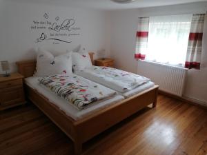 Postel nebo postele na pokoji v ubytování Ferienwohnung Weppermühle