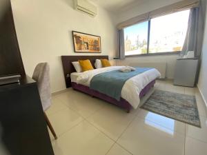 Ein Bett oder Betten in einem Zimmer der Unterkunft Lemon Tree Residence