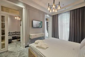 Кровать или кровати в номере Continental Hotel Samarkand