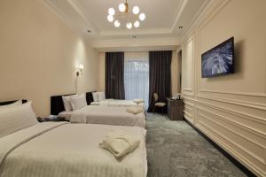 Кровать или кровати в номере Continental Hotel Samarkand