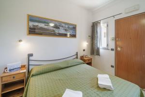 Postel nebo postele na pokoji v ubytování Hotel Villa Wanda