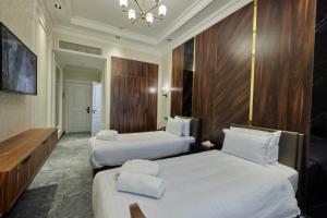 Кровать или кровати в номере Continental Hotel Samarkand
