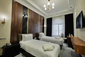 Кровать или кровати в номере Continental Hotel Samarkand +29 фотографий