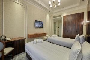 Телевизор и/или развлекательный центр в Continental Hotel Samarkand