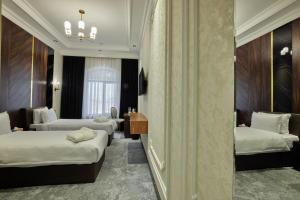 Кровать или кровати в номере Continental Hotel Samarkand