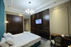 Телевизор и/или развлекательный центр в Continental Hotel Samarkand