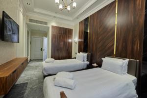 Кровать или кровати в номере Continental Hotel Samarkand