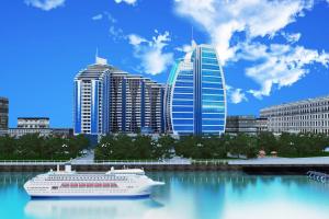 a cruise ship in the water in a city at Megafun Luxury Family Apartment in Baku
